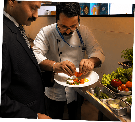 Chefs carefully plating a dish