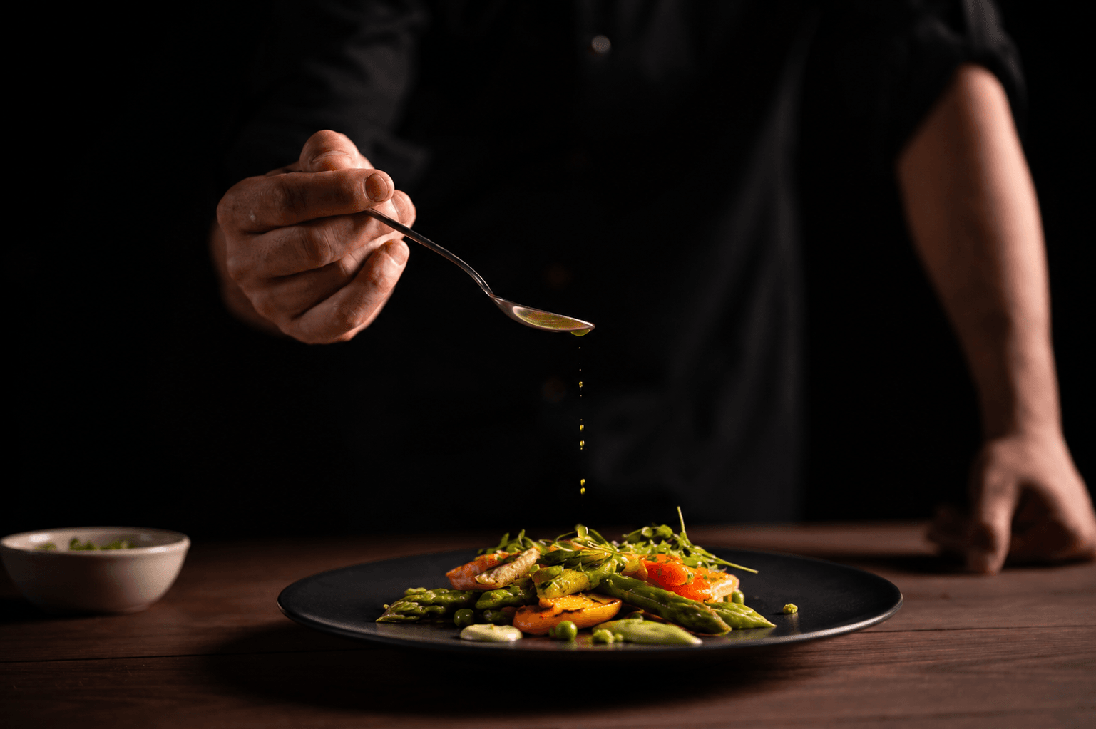 Chef plating a gourmet culinary dish