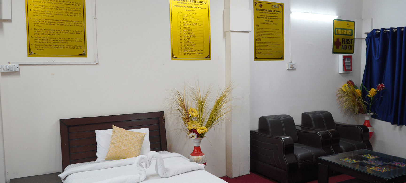 Housekeeping training room with hotel bed setup