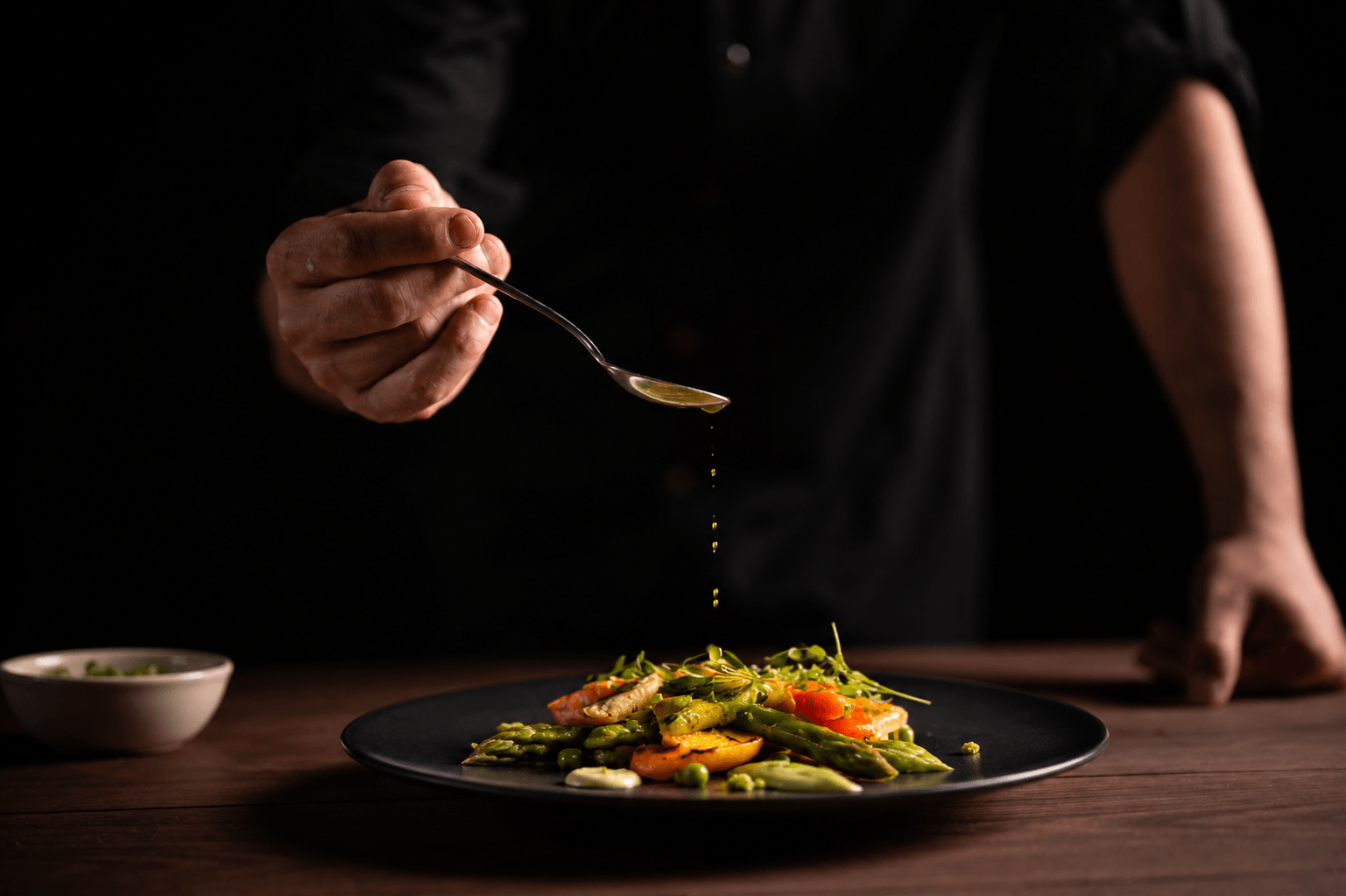 Chef plating a gourmet vegetable dish